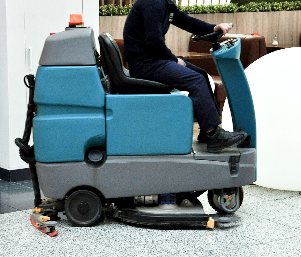 Floor scrubbing machine operator